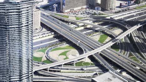 Slow-motion-shot-looking-over-busy-highway-Intersection-in-Downtown,-Dubai