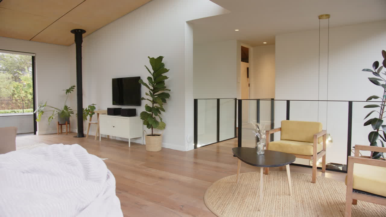 Modern living room with indoor plants, cozy seating area, and natural light, copy space
