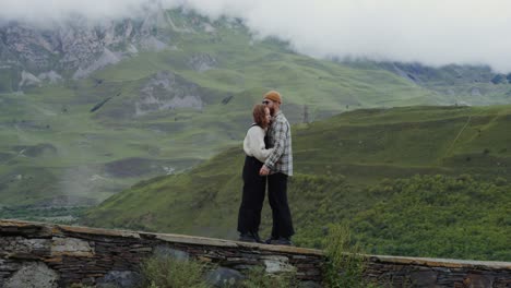 couple hugging in the mountains