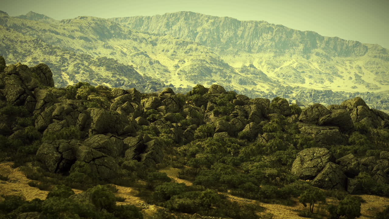 Rugged mountains and rocky terrain shine under bright sunlight