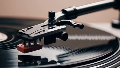close-up of a turntable with vinyl record and tonearm
