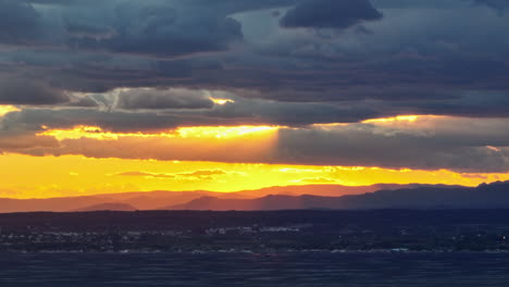 aerial shot at sunset: balaruc-les-bains enjoys etang de thau's serene beauty.