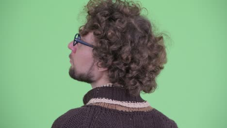 young handsome bearded man with curly hair