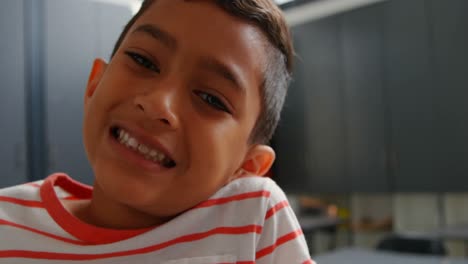 close-up of asian schoolboy standing in classroom at school 4k