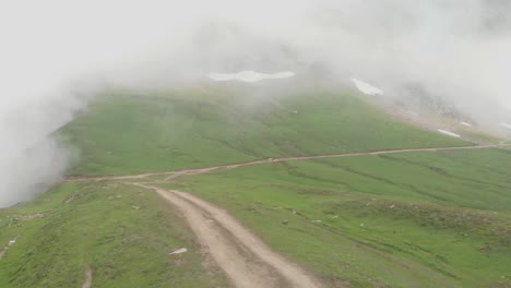 aerial view of misty baboon valley along empty path in baboon valley in kashmir