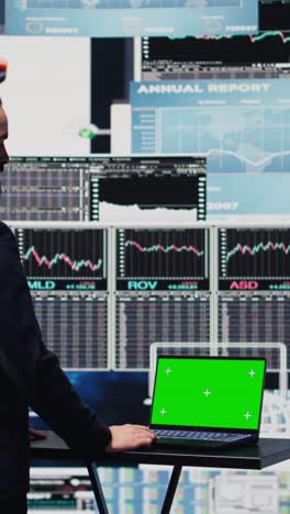 vertical video businessman looks at green screen on phone for annual trends