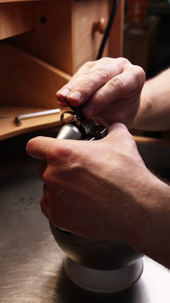 Close-Up of Jeweler's Hands Working on a Gold Ring