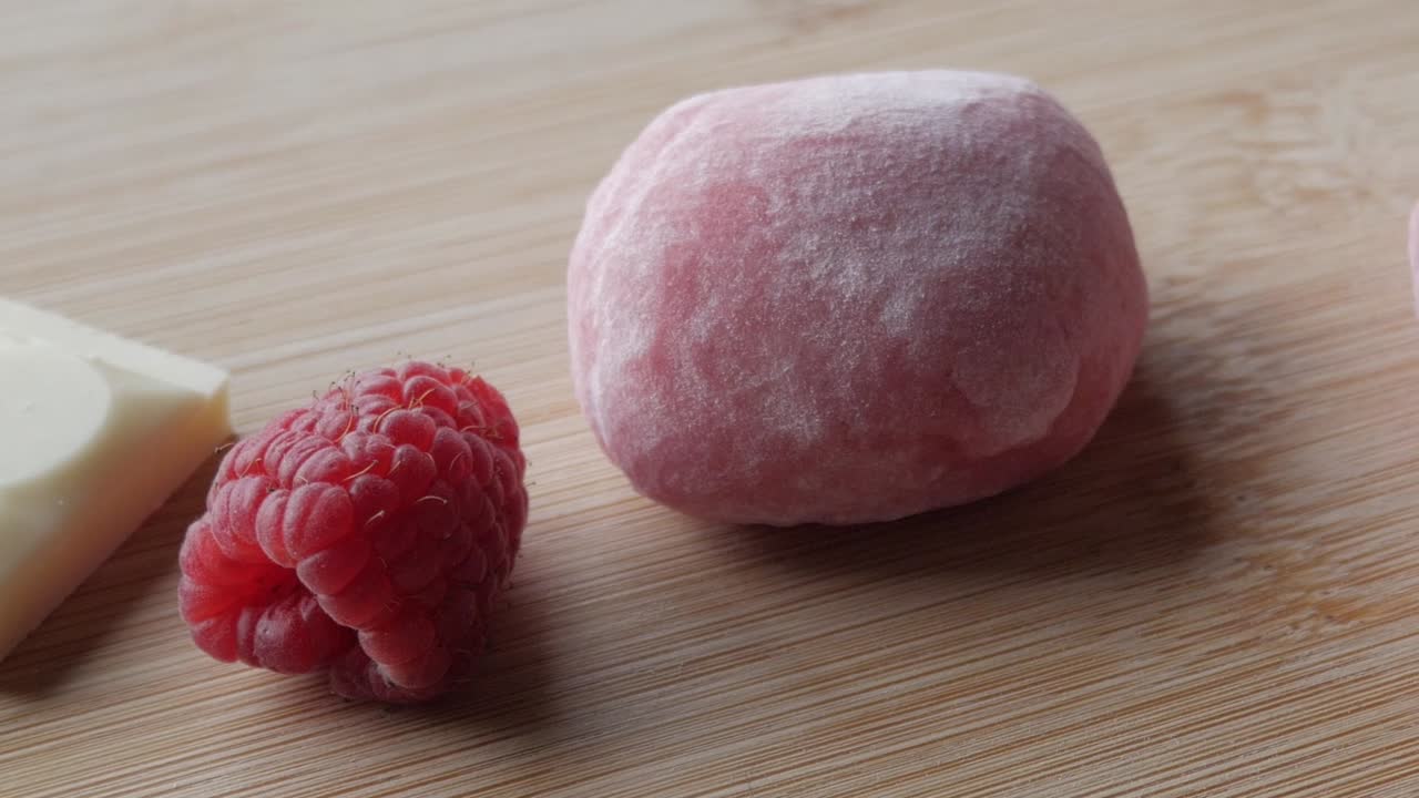 Delicious strawberry-flavored mochi filled with creamy white chocolate, close-up shot