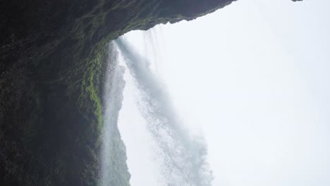 looking up at a waterfall in iceland - slow motion