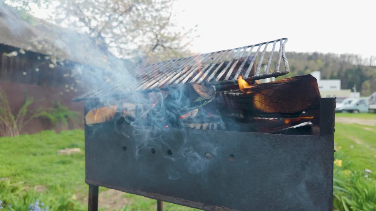 Slowmotion video of meat cooking on a grill