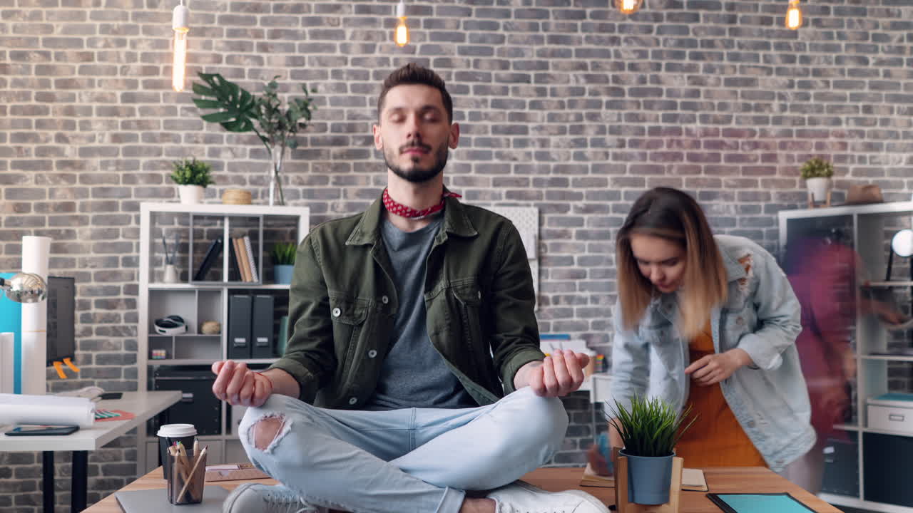 Man meditating in office