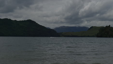 jet ski going across lake okareka, rotorua, new zealand.