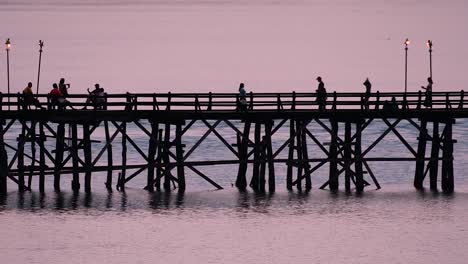 The-Mon-Bridge-is-an-old-wooden-bridge-located-in-Sangkla,-Thailand