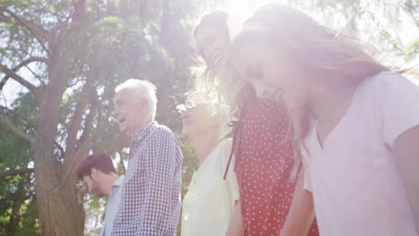 multi-generation family walking together in the park