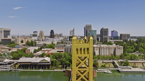 Sacramento-City-California-Aerial-v14-low-flyover-iconic-tower-bridge-leading-to-capitol-mall-towards-capitol-building-on-the-east-end-capturing-downtown-cityscape---Shot-with-Mavic-3-Cine---June-2022