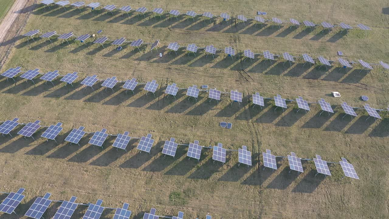 Aerial view of Solar Panels Farm. Drone flight fly over solar panels field renewable green alternative energy concept. Lithuania
