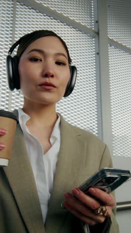 businesswoman commuting with coffee and phone