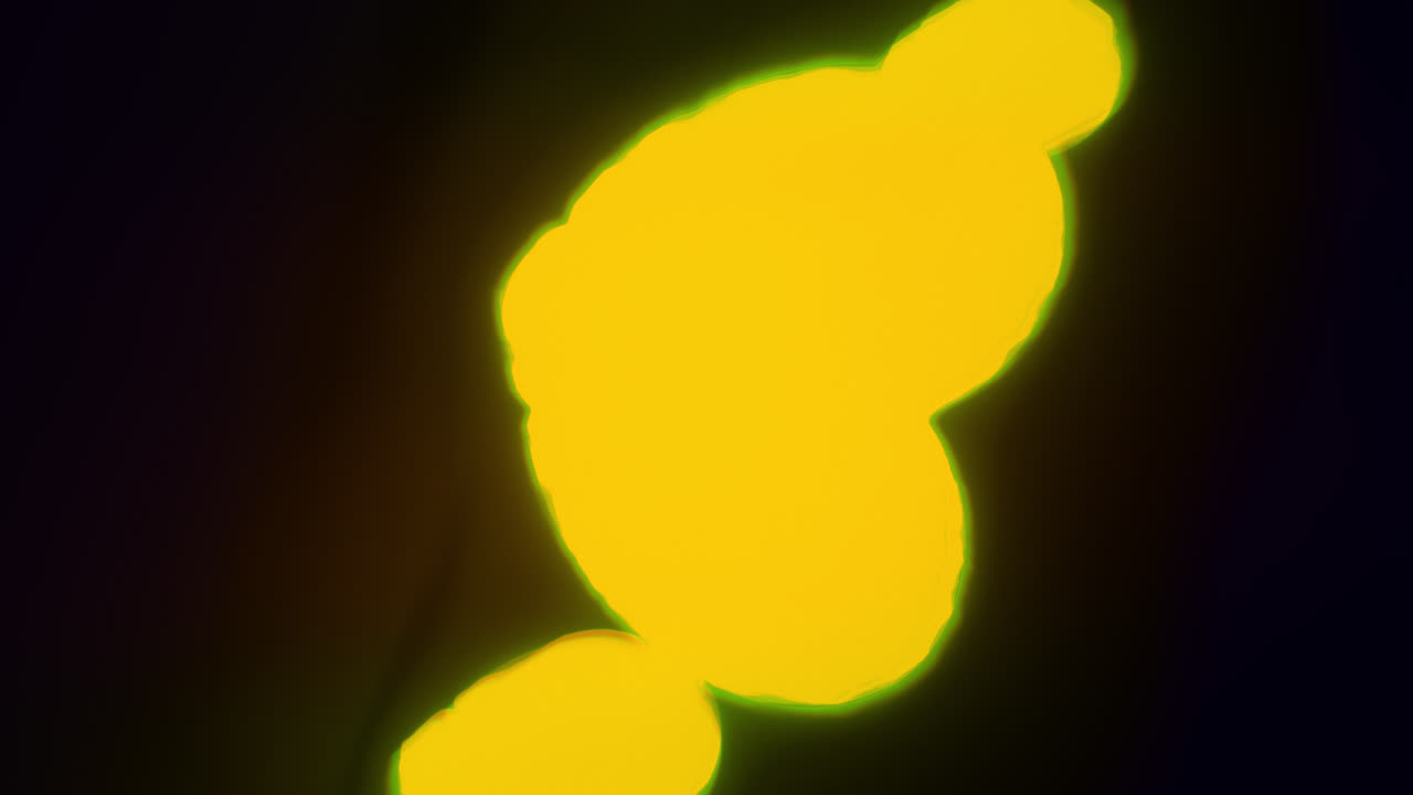 Yellow energy heart shapes on a dark background