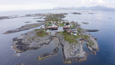 high areal reveal shot of a small settlement on a nordic island