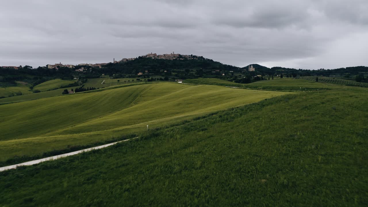 Low aerial shot flying over Italy's remote farmland