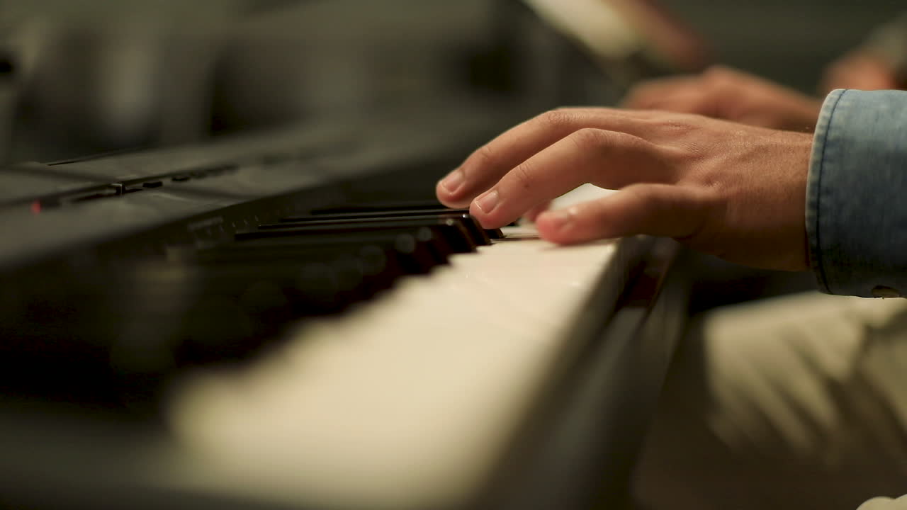 A man playing the piano - close up- slow motion