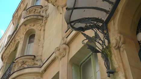 arum leaves sculpture at the main door of les arums building at 33 rue du champs de mars in paris, france. art nouveau design by architect octave raquin. close up, low angle