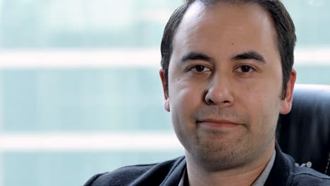 close up view of a male talking head speaking directly into the camera