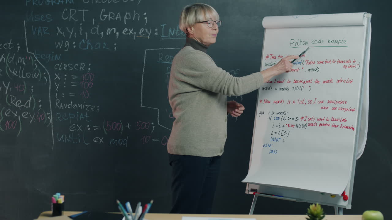 Senior Woman Teacher Presenting Python Code Lecture