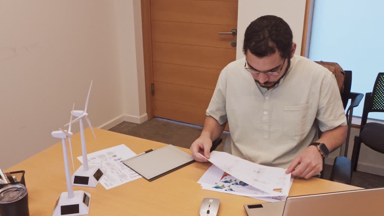 Engineer working on renewable wind energy project designs