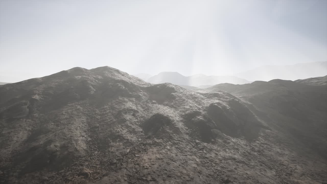 Sun Rays against the Backdrop of the Mountains
