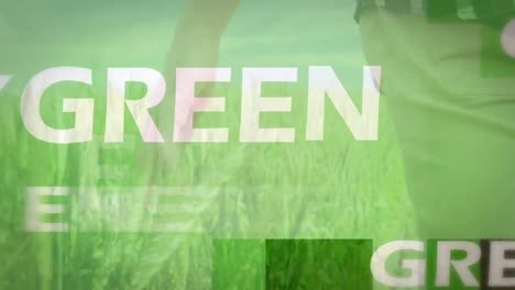 animation of green energy over hand of caucasian man walking on meadow