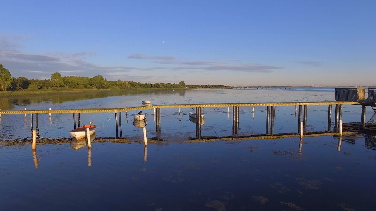 Aerial view of a Wooden pier with attached boats