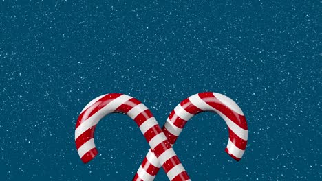 animation of snow falling and candy canes on blue background