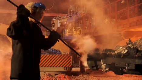 industrial worker handling hot metal