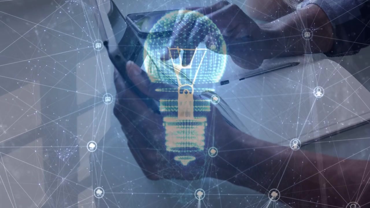 Man holding device as holographic lightbulb appears, right hand tapping to demo AR brightening