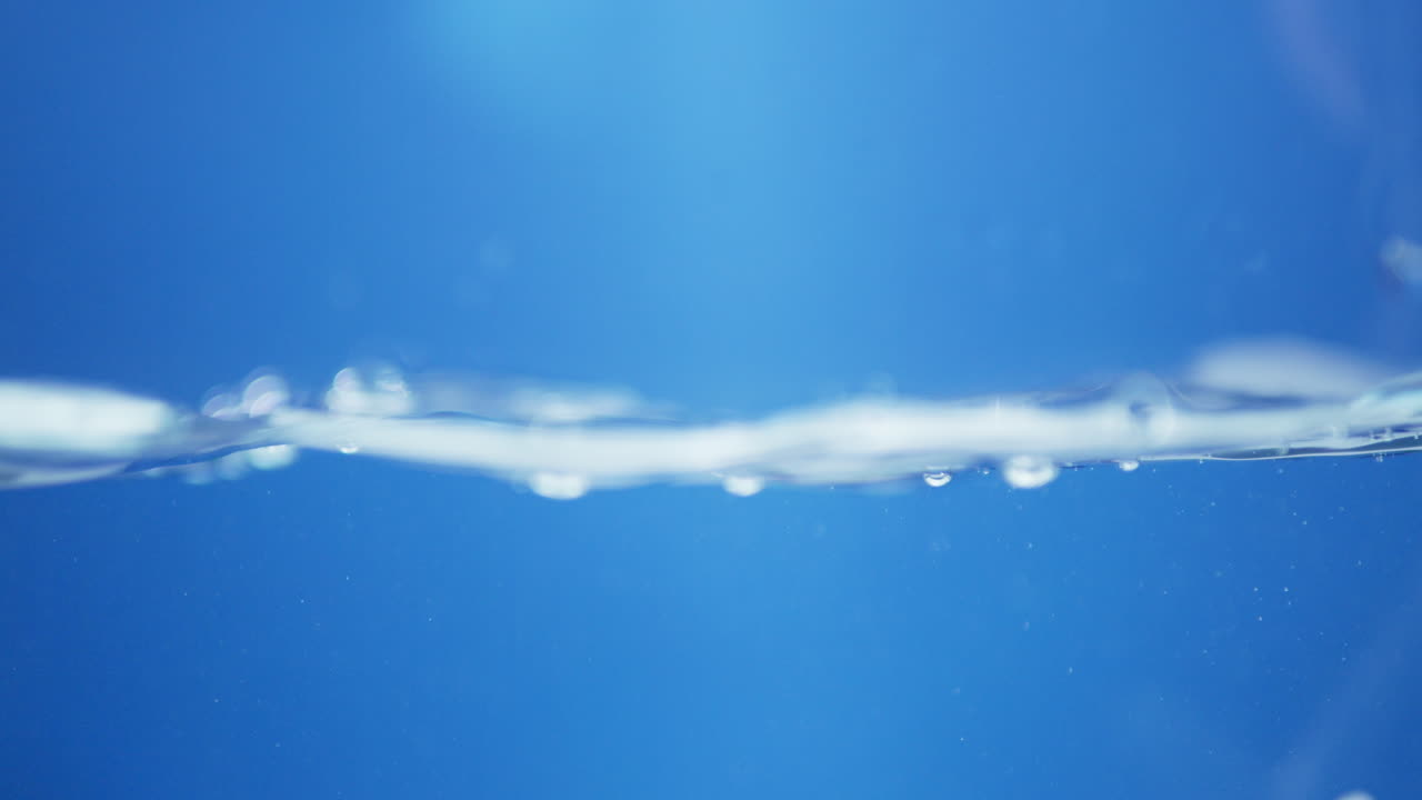 Blue Water Surface Ripple: Abstract Fluid Patterns in a Calm, Natural Environment