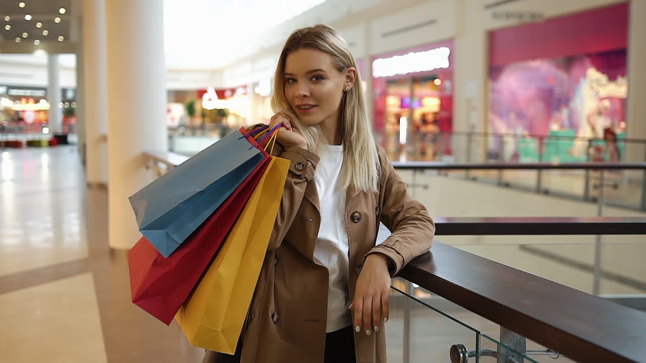 Woman with Shopping Bags in Mall