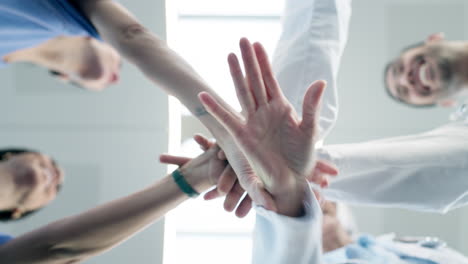 hands, teamwork or doctors in huddle with support