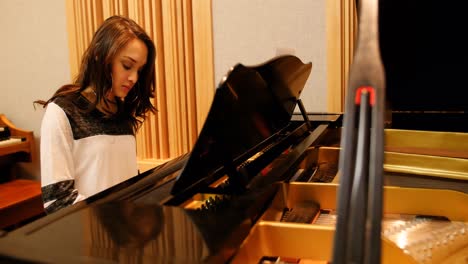 woman playing a piano