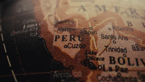close-up of a world map highlighting peru