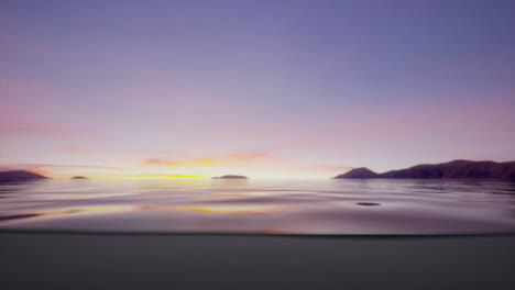 sunset over the ocean with mountains in the distance