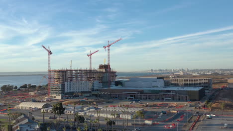 The-new-convention-center-being-build-in-Chula-Vista-California,-with-San-Diego-skyline-in-the-distance