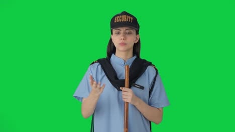 indian female security guard talking to someone green screen