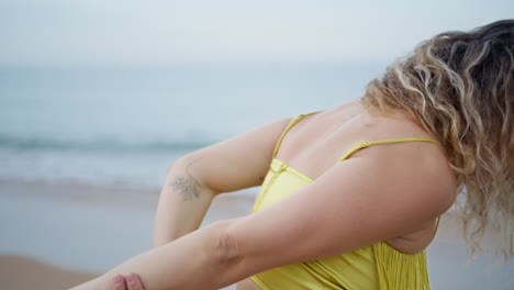 expressive girl performing dance on beach close up. professional choreographer