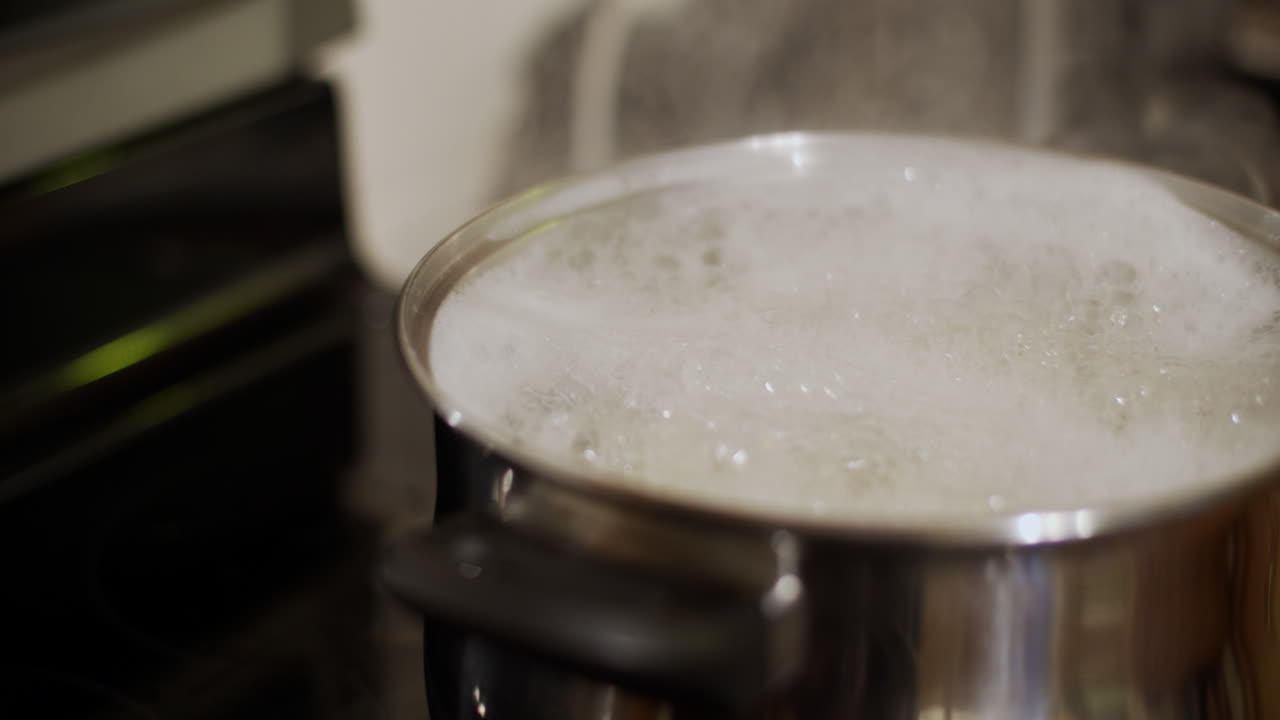 Pastas cooking on the oven in boiling water