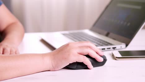 businesswoman hand using mouse working on notebook technology and business concept