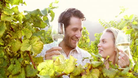 Young-happy-couple-holding-wine-glasses