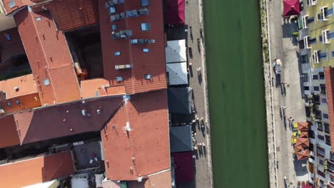 Navigli-district-rooftops-and-canal-in-Milan-city,-top-down-view