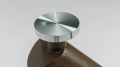 slow zoom in on machined metal furniture table accent