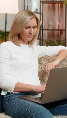 adult angry woman closing laptop with frustration at home irritation emotional exhaustion stress